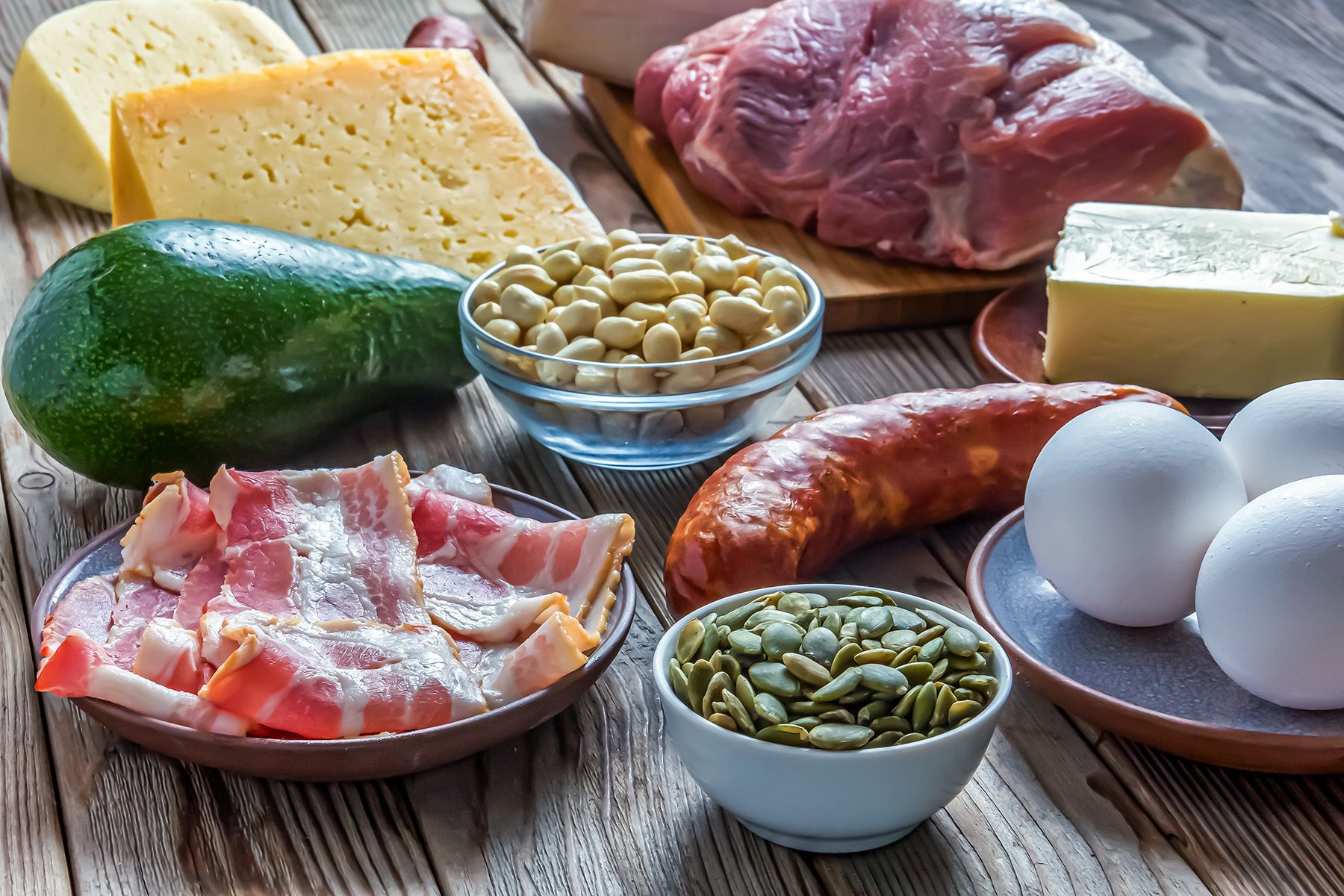 a glorious array of nuts, eggs, sausages, and fatty foods for a ketogenic diet