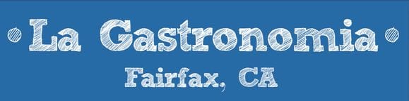 La Gastronomia wordmark: white chalk-style lettering with "Fairfax, CA" on a blue banner