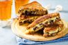 a gouda, mushroom grilled cheese sandwich on a platter