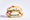 A panino con mortadella e pistacchi: folded pink mortadella and a ball of creamy white stracciatella over green pistachio pesto in a ciabatta roll, on a white background.
