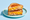 A tuna melt cut in half and stacked on a pale blue plate, griddled bread around tuna salad and melted orange cheese.