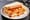 Baltimore lake trout sandwich: saltine-crusted fried whiting fillets between two slices of soft white bread with hot sauce.