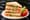 Argentine sandwich de miga triple: four sheets of crustless white bread layered with ham, cheese, tomato, lettuce and egg, cut into triangles.