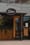 Divan storefront: oval Divan sign above a wood-framed door, planter boxes and string lights