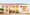 Loveski storefront: white clapboard facade with MADE WITH LOVE painted in red, open blue doors, red bistro chairs