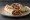 Adana Dürüm: an illustration of lamb, onion, parsley, sumac and more on pita.