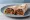 Adana Kebab Dürüm: an illustration of lamb, onion, parsley, sumac and more on pita.