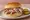 Alabama Smoked Chicken (Big Bob Gibson): an illustration of chicken, mayonnaise, vinegar, pepper and more on burger bun.