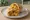 Aloo Kathi Roll: an illustration of potato on naan.