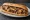 American Wit: an illustration of beef, american cheese and onion on hoagie roll.