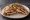 Arayes Halloum (عرايس حلوم): an illustration of halloumi on pita.