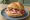 Aufschnitt Brötchen: an illustration of pork on kaiser roll.