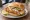 Backfisch mit Remoulade: an illustration of fish, remoulade and pickle on kaiser roll.