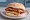 Bacon and Tattie Scone: an illustration of bacon, brown sauce and ketchup.