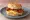 Bacon Biscuit: an illustration of bacon, egg and butter on buttermilk biscuit.
