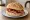 Bacon Cob: an illustration of bacon, butter, brown sauce and ketchup.