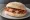 Bacon Roll: an illustration of bacon, butter, brown sauce and ketchup.