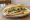 Balık Ekmek Eminönü: an illustration of onion, lettuce and lemon on bread.