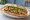 Bánh Mì Đà Nẵng: an illustration of pork, đồ chua, cilantro, cucumber and more on bánh mì baguette.