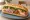 Bánh Mì Đặc Biệt: an illustration of chả lụa, thịt nguội, ham, pâté and more on bánh mì baguette.