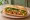 Bánh Mì Đậu Hũ Chiên Sả Ớt: an illustration of tofu, lemongrass, pepper, đồ chua and more on bánh mì baguette.