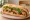 Bánh Mì Đậu Hũ Nướng: an illustration of tofu, đồ chua, cilantro, cucumber and more on bánh mì baguette.