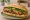 Bánh Mì Bò Chay: an illustration of mayonnaise, đồ chua, cucumber, cilantro and more on bánh mì baguette.