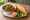 Bánh Mì Bò Kho Bánh Mì: an illustration of beef, mayonnaise, đồ chua, cucumber and more on bánh mì baguette.