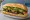Bánh Mì Bò Lá Lốt: an illustration of beef, mayonnaise, đồ chua, cucumber and more on bánh mì baguette.