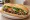 Bánh Mì Bò Nướng: an illustration of beef, garlic, mayonnaise, đồ chua and more on bánh mì baguette.