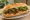 Bánh Mì Bò Sốt Tiêu Đen: an illustration of beef, pepper, mayonnaise, đồ chua and more on bánh mì baguette.