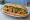 Bánh Mì Bò Viên: an illustration of beef, mayonnaise, đồ chua, cucumber and more on bánh mì baguette.