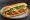 Bánh Mì Bò Xào Ớt Chuông: an illustration of beef, pepper, mayonnaise, đồ chua and more on bánh mì baguette.