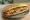 Bánh Mì Cay: an illustration of pork, pepper, mayonnaise, đồ chua and more on bánh mì baguette.
