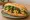 Bánh Mì Chả Cá Lã Vọng: an illustration of fish, dill, đồ chua, cucumber and more on bánh mì baguette.
