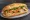 Bánh Mì Chả Cá Nha Trang: an illustration of fish, đồ chua, cucumber, cilantro and more on bánh mì baguette.