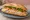 Bánh Mì Chả Lụa: an illustration of chả lụa, đồ chua, cucumber, cilantro and more on bánh mì baguette.