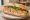 Bánh Mì Chả Trứng Hấp: an illustration of pork, egg, đồ chua, cucumber and more on bánh mì baguette.