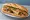Bánh Mì Cơm Tấm: an illustration of pork, egg, đồ chua, cucumber and more on bánh mì baguette.
