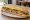 Bánh Mì Dài: an illustration of pork, đồ chua, cucumber, cilantro and more on bánh mì baguette.