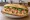 Bánh Mì Gà: an illustration of chicken, đồ chua, cucumber, cilantro and more on bánh mì baguette.