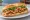 Bánh Mì Gà Nướng Mật Ong: an illustration of chicken, honey, đồ chua, cucumber and more on bánh mì baguette.