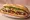 Bánh Mì Heo Nướng: an illustration of pork, pâté, đồ chua, cucumber and more on bánh mì baguette.