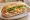 Bánh Mì Hòa Mã: an illustration of pork, chả lụa, egg, pâté and more on bánh mì baguette.