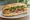 Bánh Mì Houston: an illustration of pork, chả lụa, pâté, mayonnaise and more on bánh mì baguette.