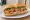 Bánh Mì Huế: an illustration of pork, chả lụa, shrimp, đồ chua and more on bánh mì baguette.