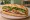 Bánh Mì Lee's: an illustration of pork, chả lụa, chicken, pâté and more on bánh mì baguette.