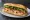 Bánh Mì Mắm Nêm: an illustration of pork, fish sauce, đồ chua, cucumber and more on bánh mì baguette.