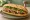 Bánh Mì Nấm Nướng: an illustration of mushroom, đồ chua, cucumber and cilantro on bánh mì baguette.
