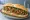 Bánh Mì Ốc: an illustration of butter, garlic, lemongrass, pepper and more on bánh mì baguette.